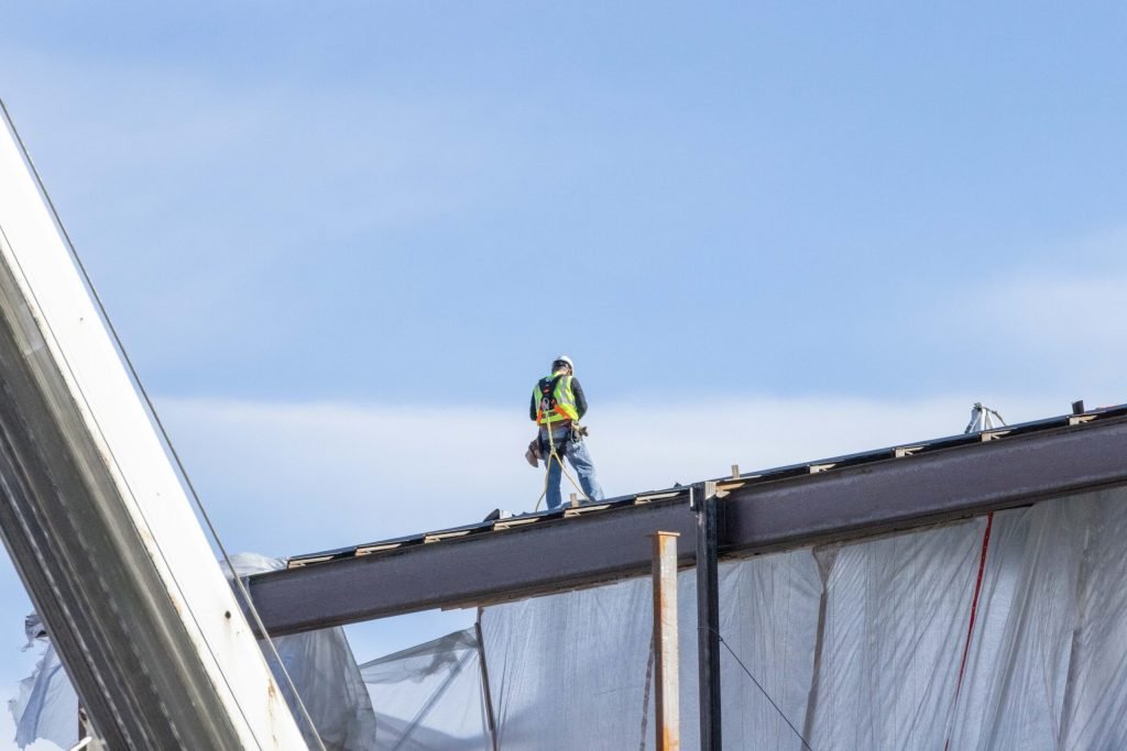 A man working on a commercial roof