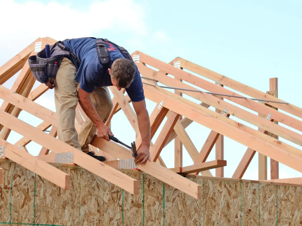 a man working on a roof from the best old forge roofer