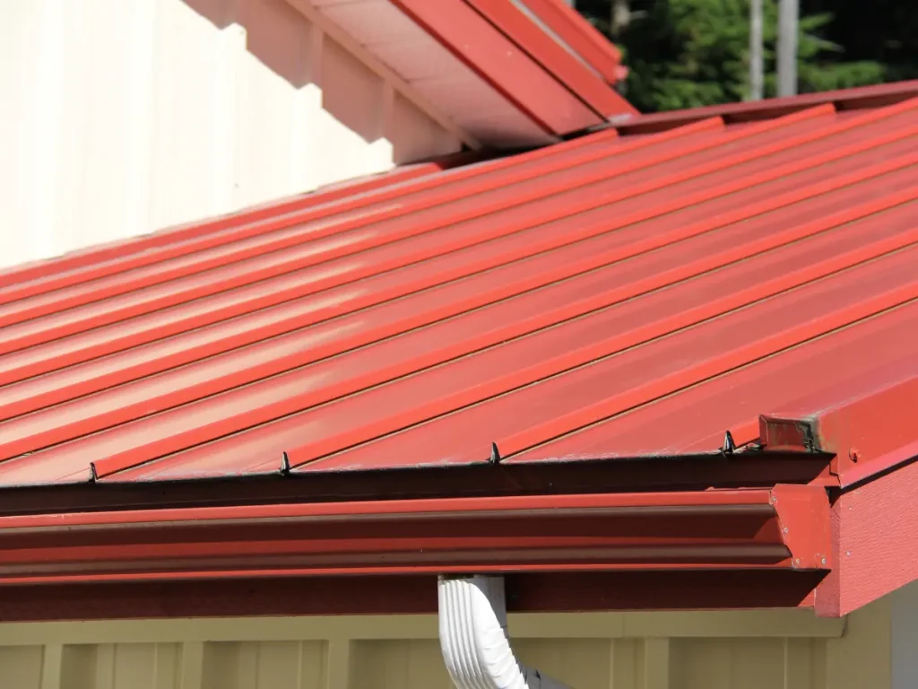 a red roof of a house from a commercial roofing contractor Lake Wallenpaupack