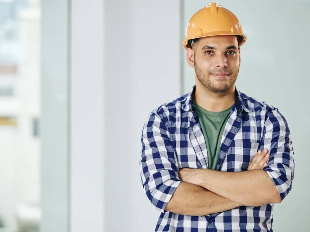 a commercial roofing contractor employee wearing a hard hat